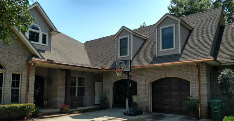 Copper seamless gutters with round downspouts