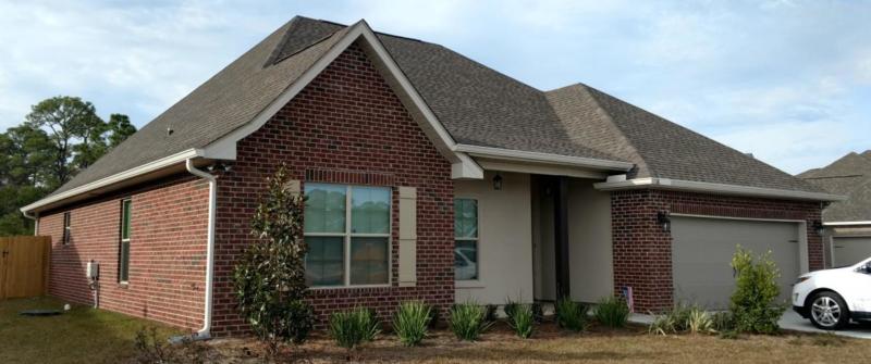 White seamless aluminum gutters with 3x4" downspouts