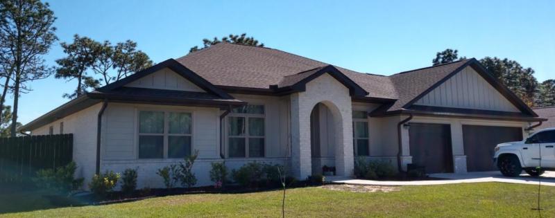 Color matched brown aluminum gutters and downspouts